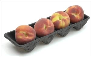 Perfect peaches in a pulp tray.